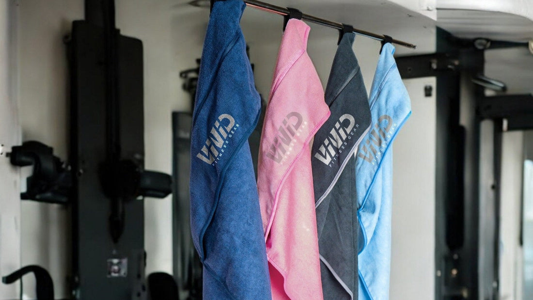 VIVID microfibre terry hooded gym towels in blue, pink, grey and light blue hanging by their hoods