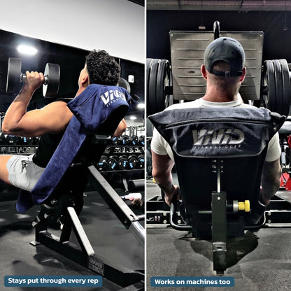 Two men training with VIVID hooded gym towels hooked over an incline bench and a seated machine